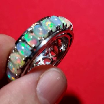 Кольцо: Крутящиеся Опалы огненные.18р