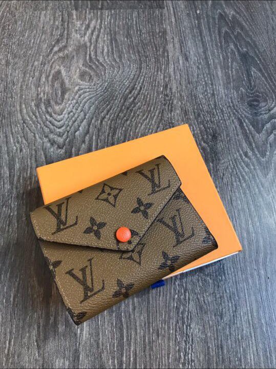 Кошелёк Louis Vuitton Emilie с оранжевой кнопкой