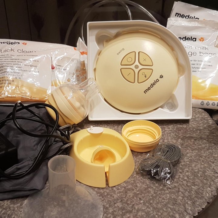 Молокоотсос Medela Swing Essentials pack