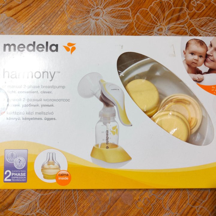 Молокоотсос medela с соской Calma