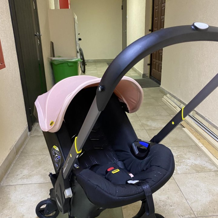 Автокресло-коляска Doona Pink с базой Isofix