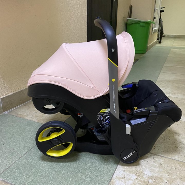 Автокресло-коляска Doona Pink с базой Isofix