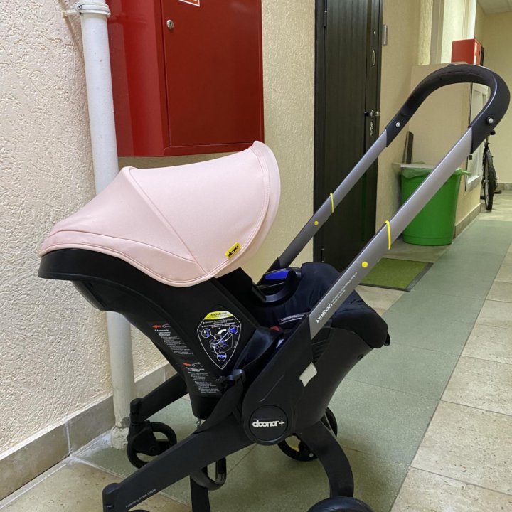 Автокресло-коляска Doona Pink с базой Isofix