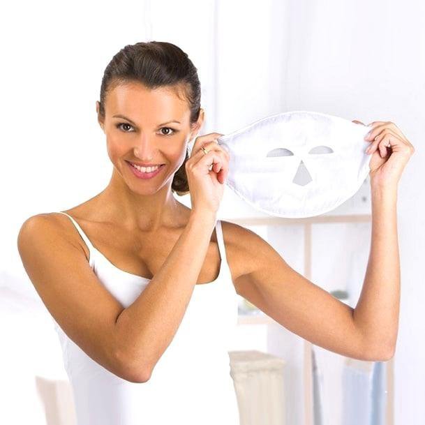 woman applying magnetic mask with applicator